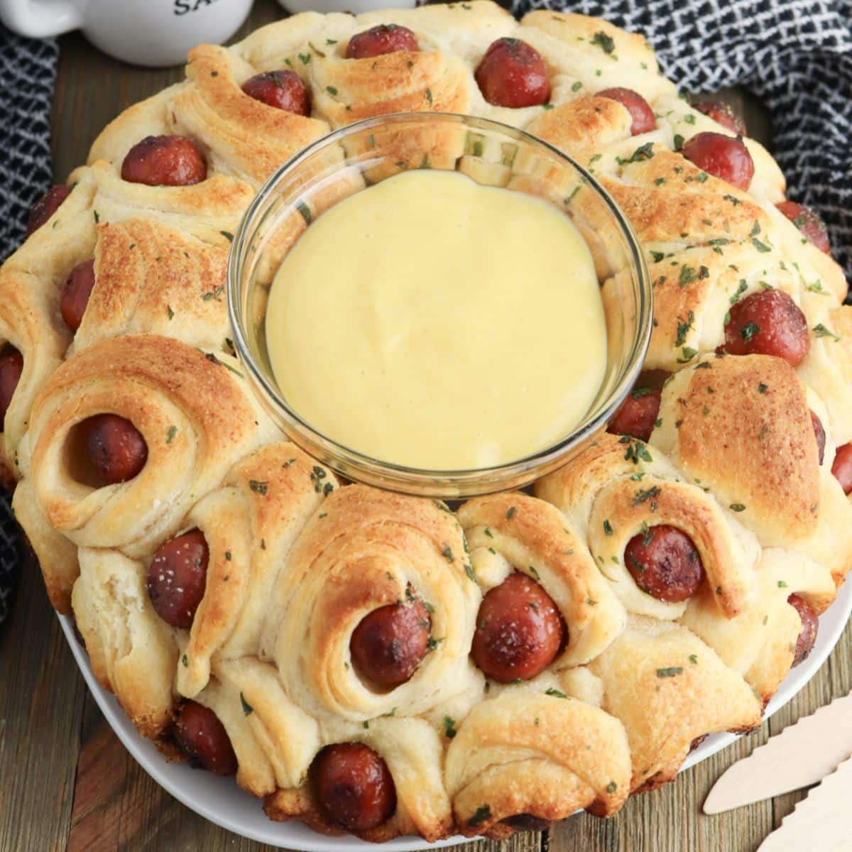 pigs in a blanket pull apart on a plate.