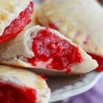 raspberry hand pie cut in half.