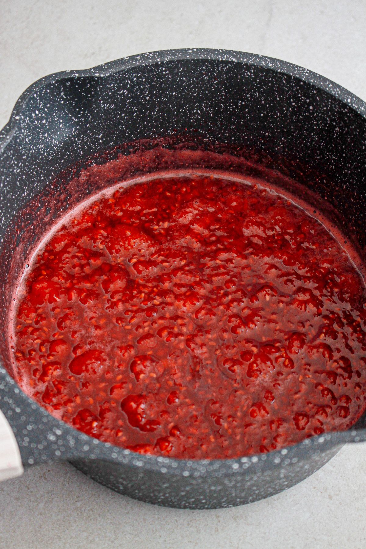 raspberry sauce in a large saucepan.