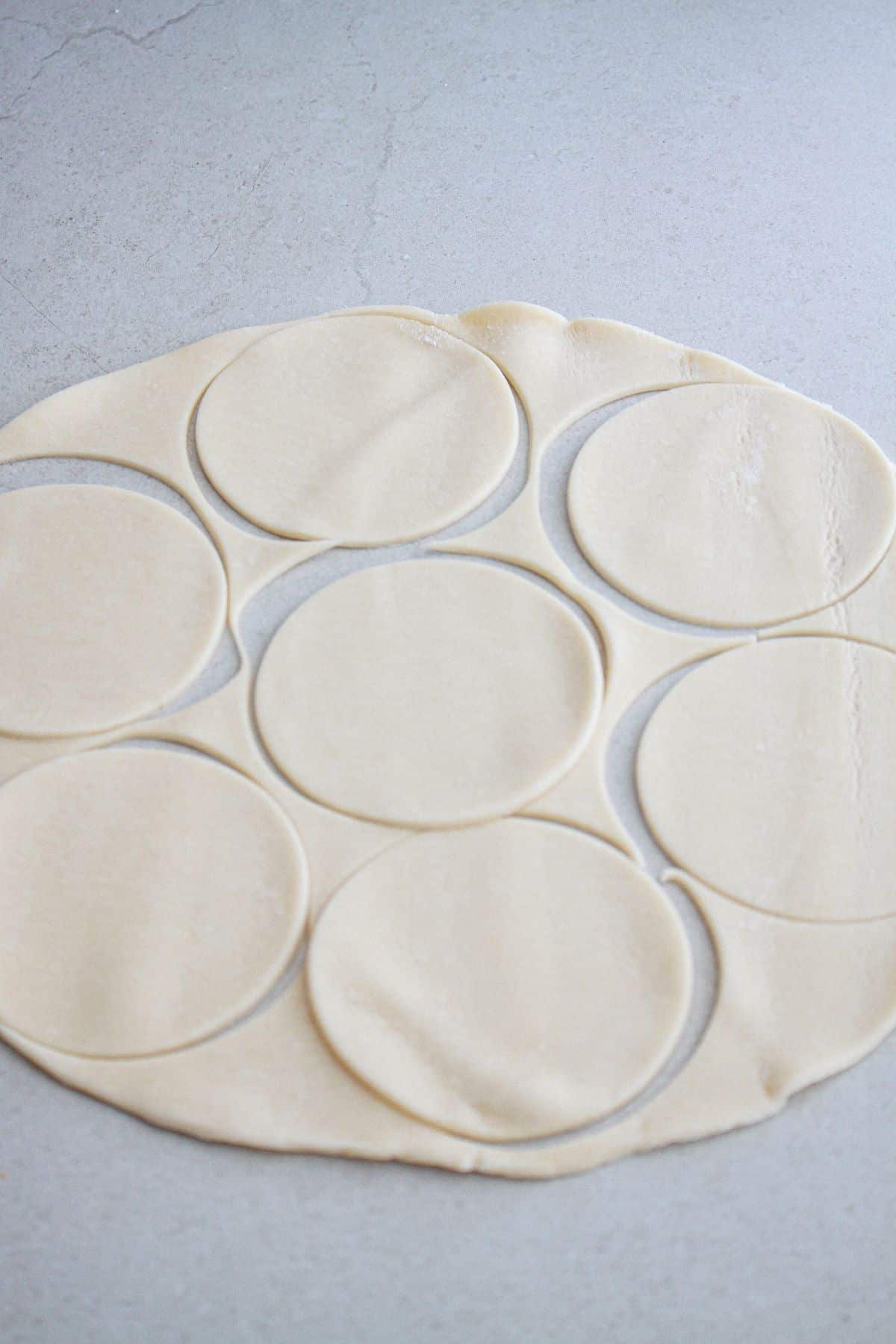 pie crust being cut into circles.