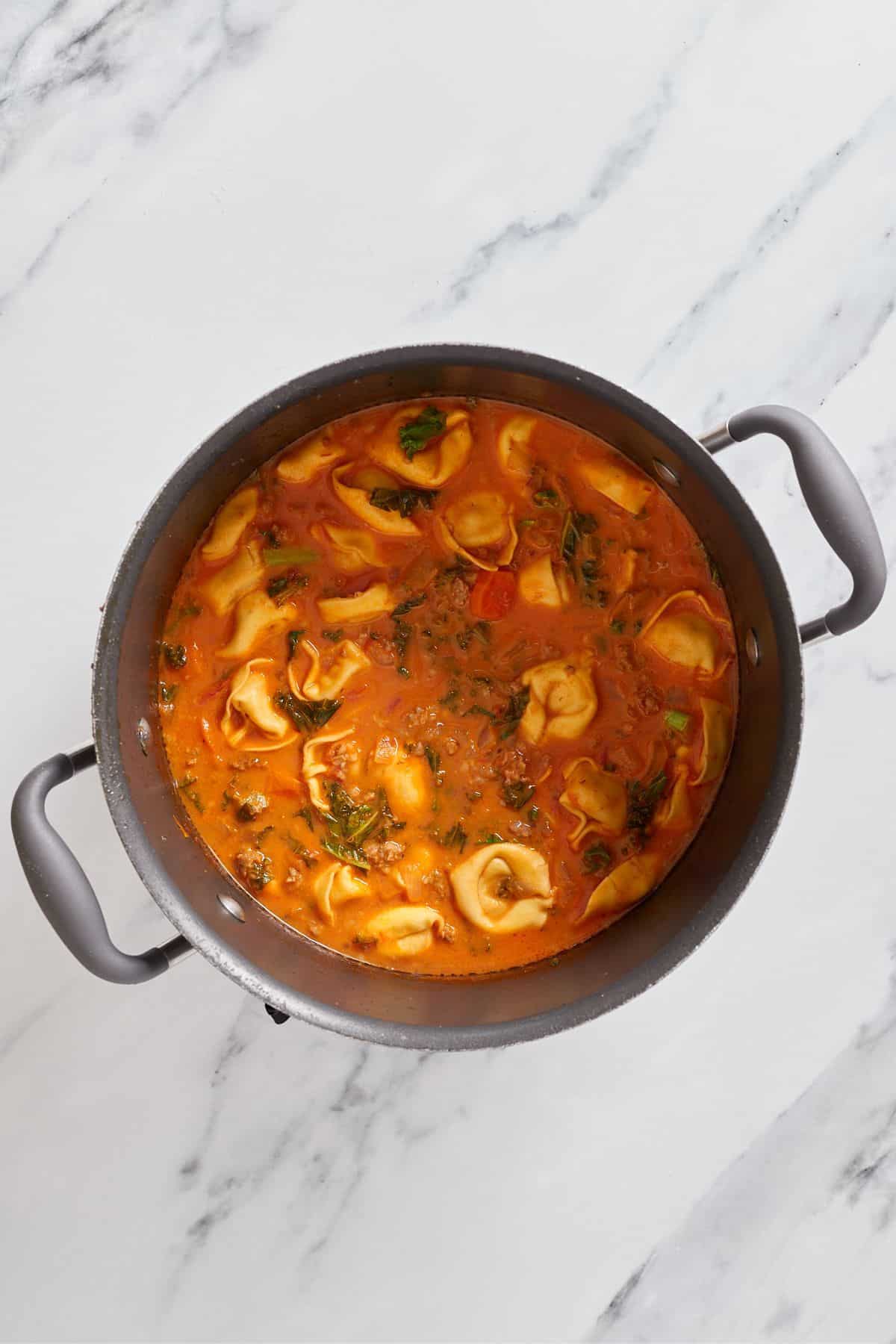 cooked tortellini soup in a large stock pot.