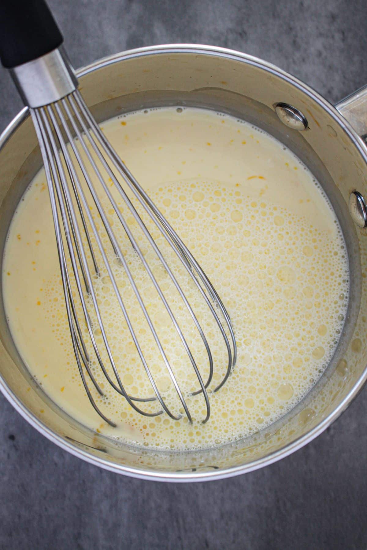 homemade pudding being cooked in a saucepan.