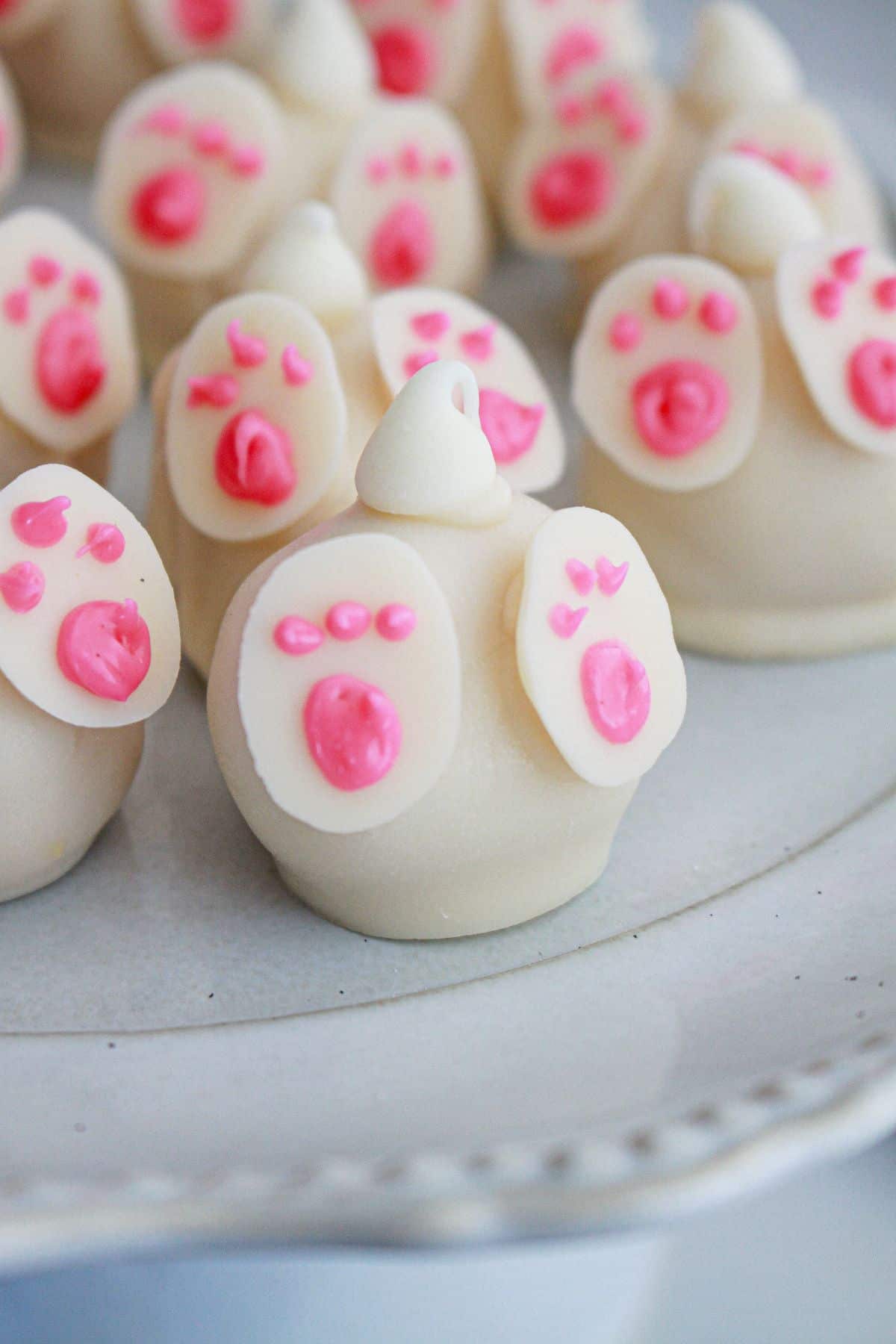 bunny butt oreo truffles on a cake plate.