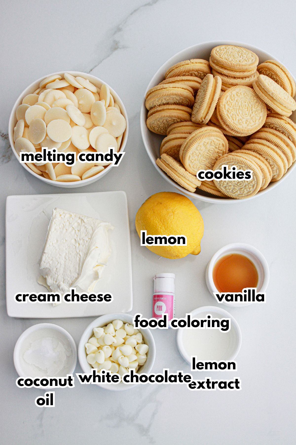 bowls of melting candy, oreo cookies, cream cheese, lemon, vanilla, coconut oil, white chocolate, food coloring, and lemon extract.