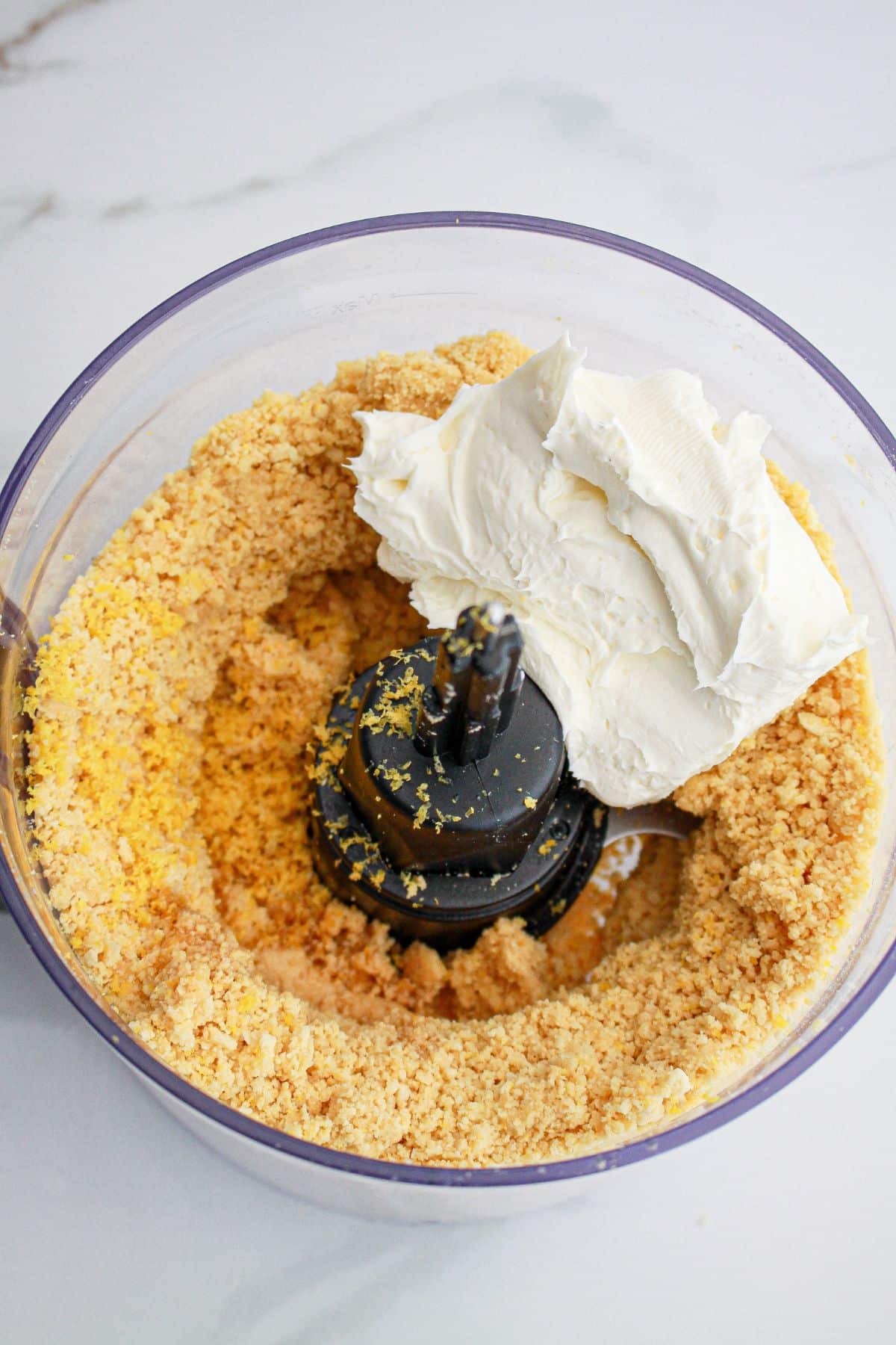 oreo cookies, lemon zest, and cream cheese in a food processor.