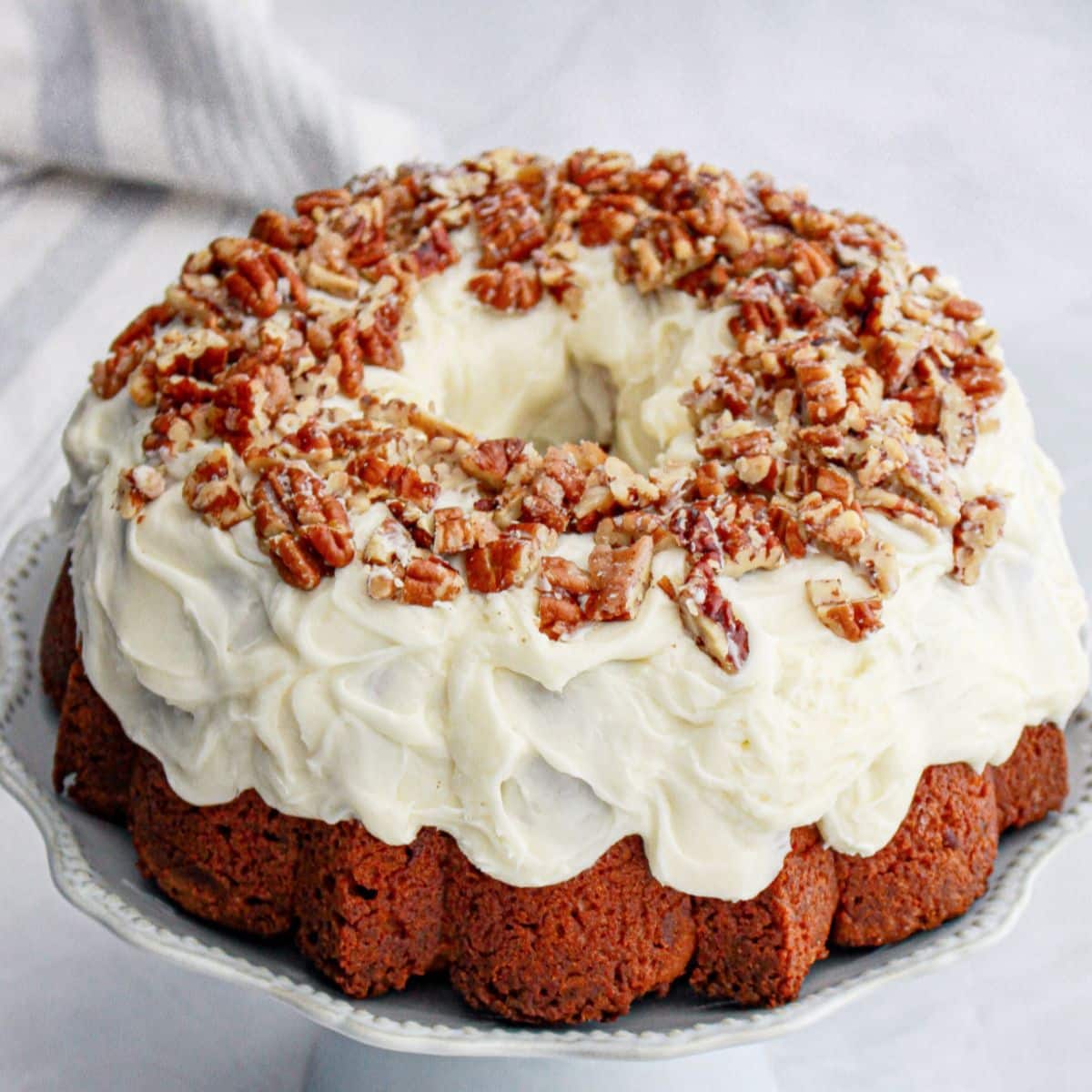 uncut pound cake on a plate.