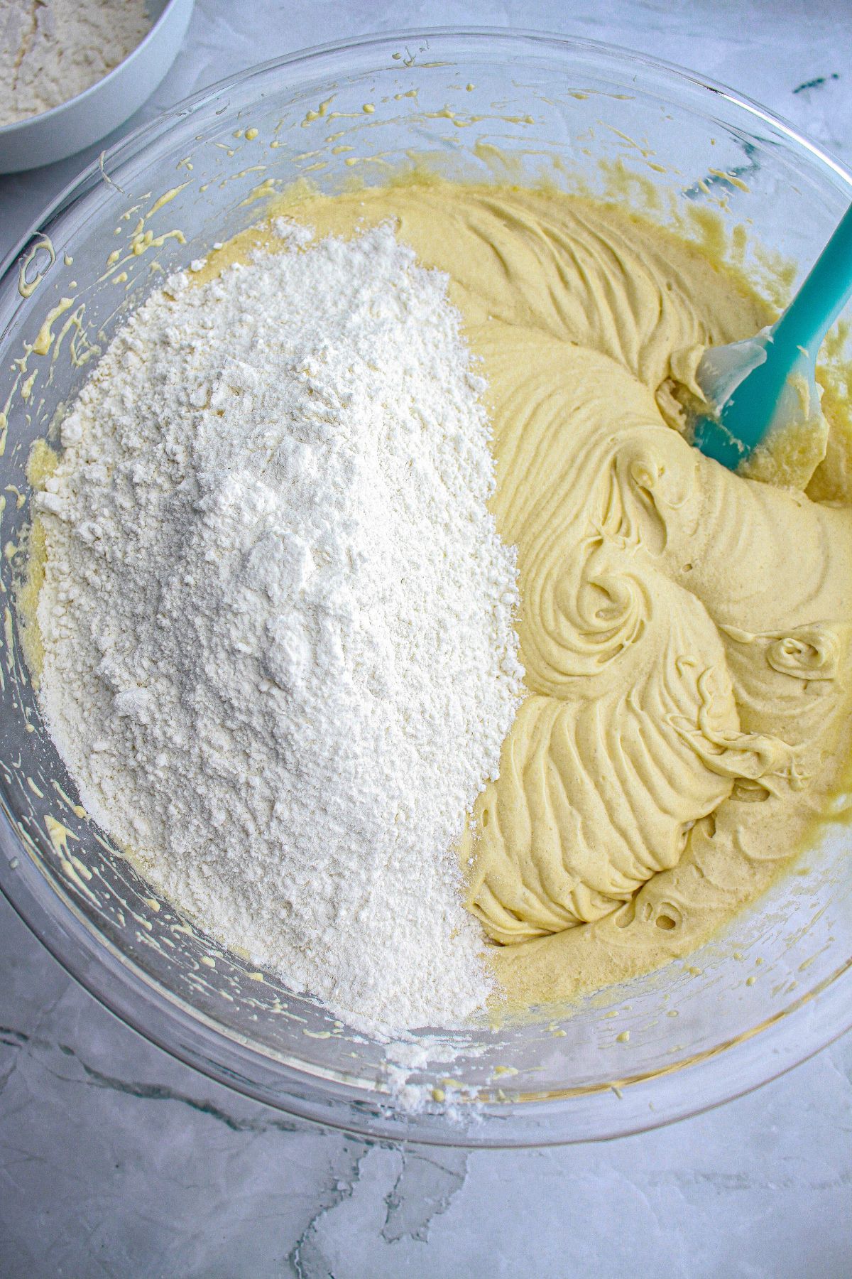 cake batter in a glass mixing bowl.