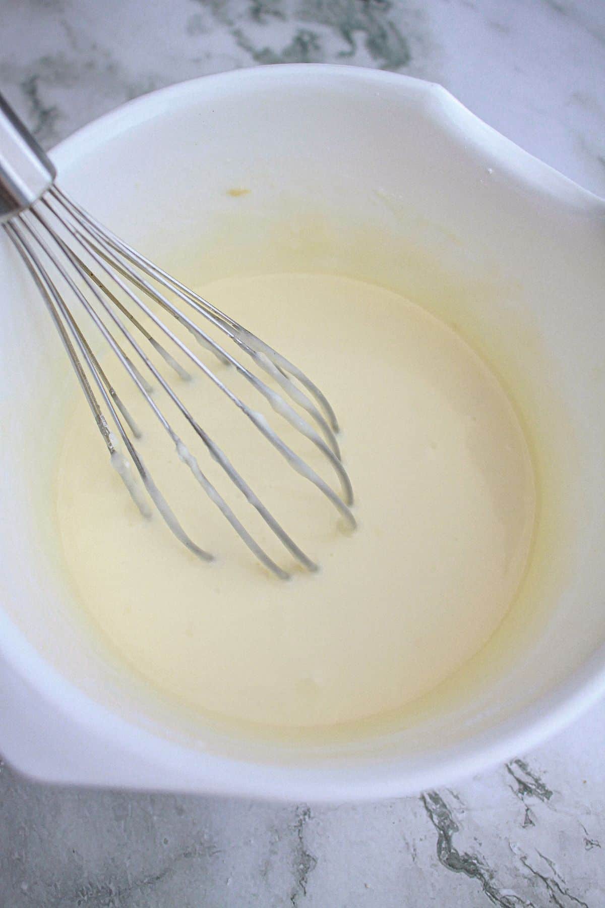 glaze being mixed in a bowl.