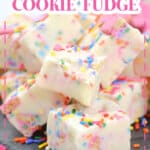 pieces of circus animal cookie fudge stacked on a piece of marble.