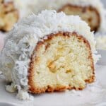 slice of coconut white chocolate cake on a plate.