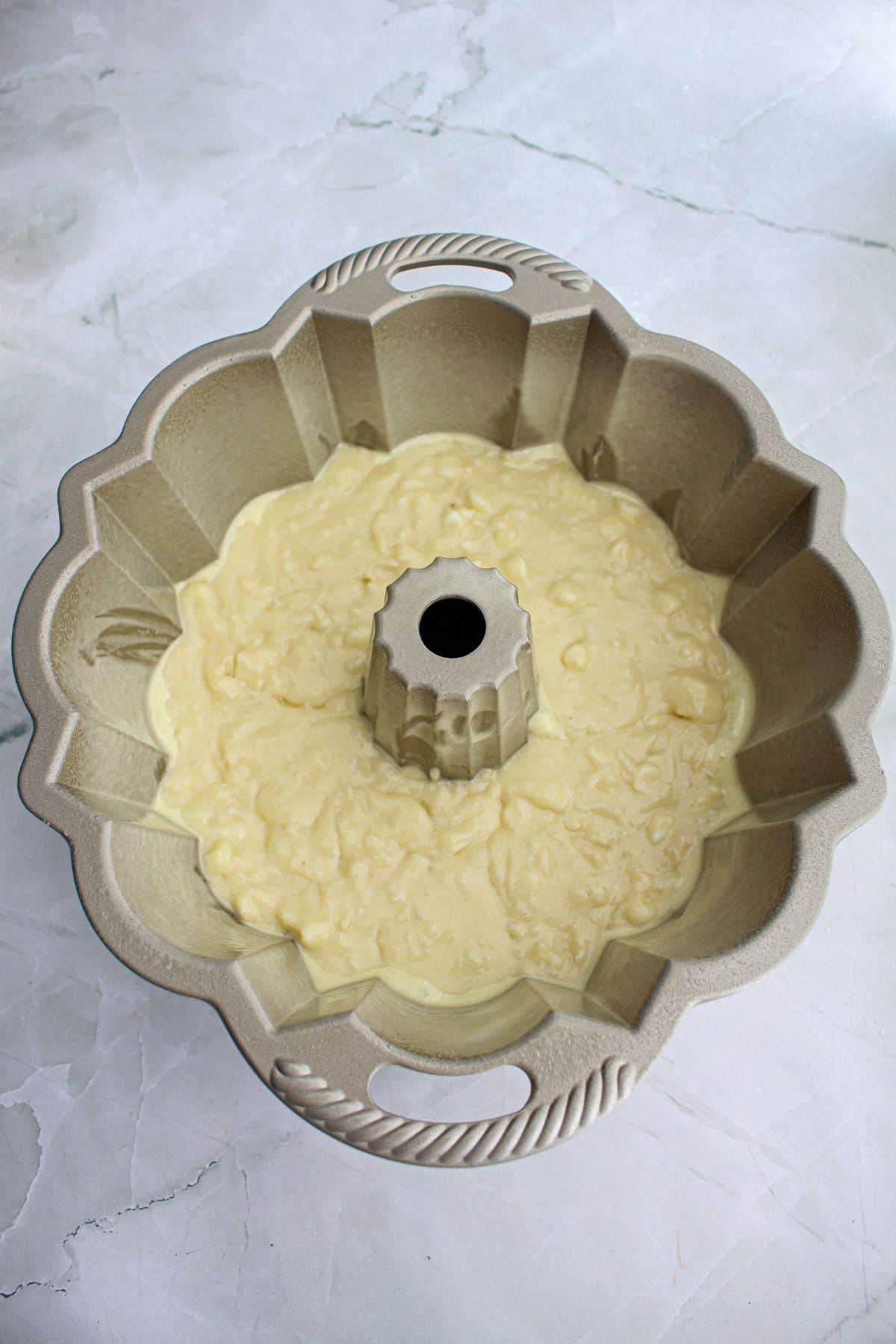 cake batter in a flouted bundt cake pan.