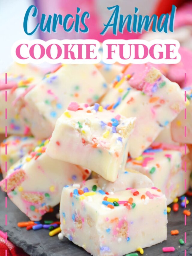 pieces of circus animal cookie fudge stacked on a piece of marble.