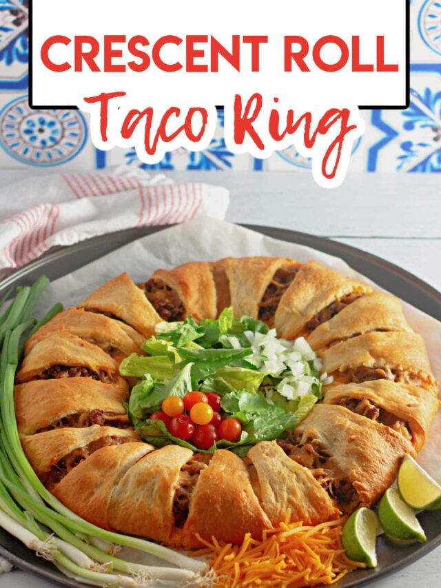 uncut taco crescent ring on a parchment lined baking sheet.