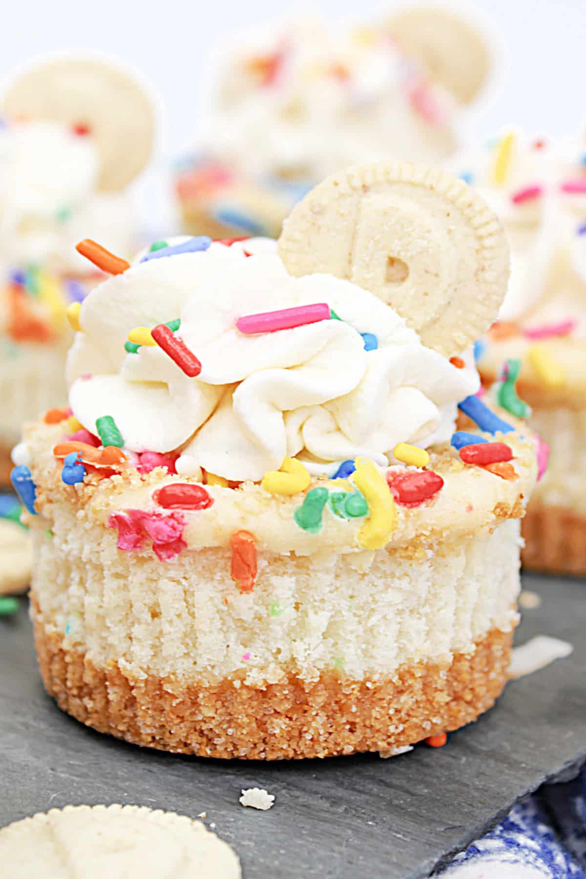 mini dunkaroo cheesecakes on a piece of marble.