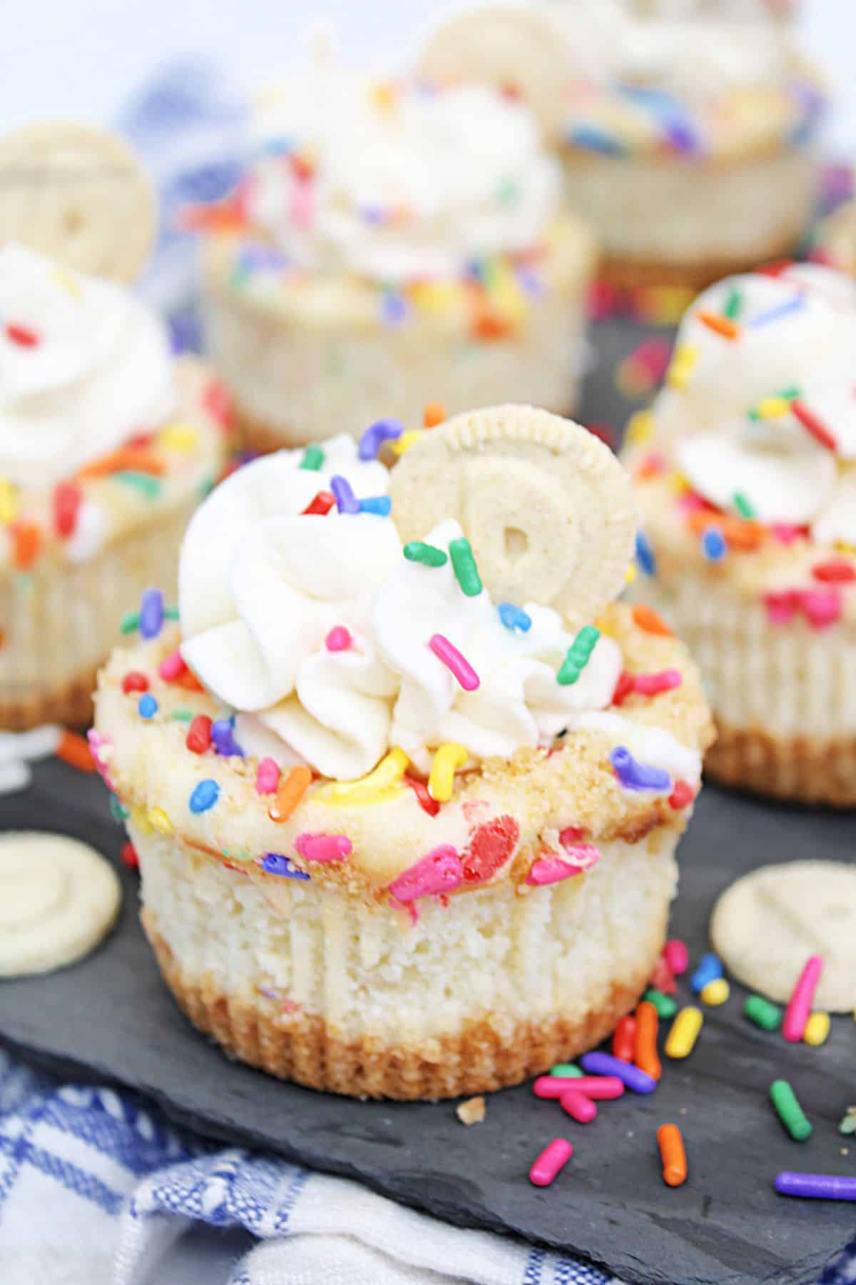 mini dunkaroo cheesecakes on a piece of marble.