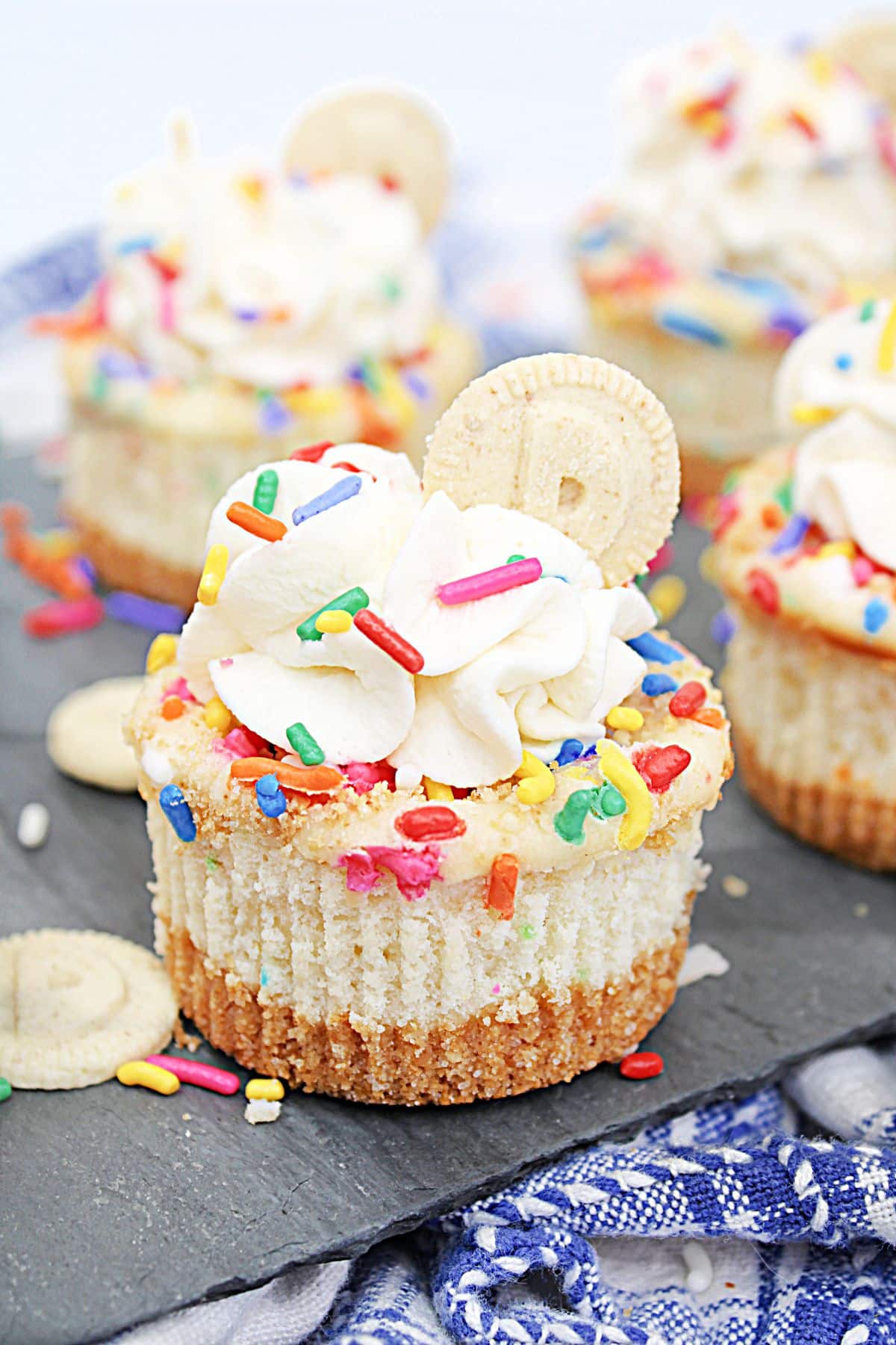 mini dunkaroo cheesecakes on a piece of marble.