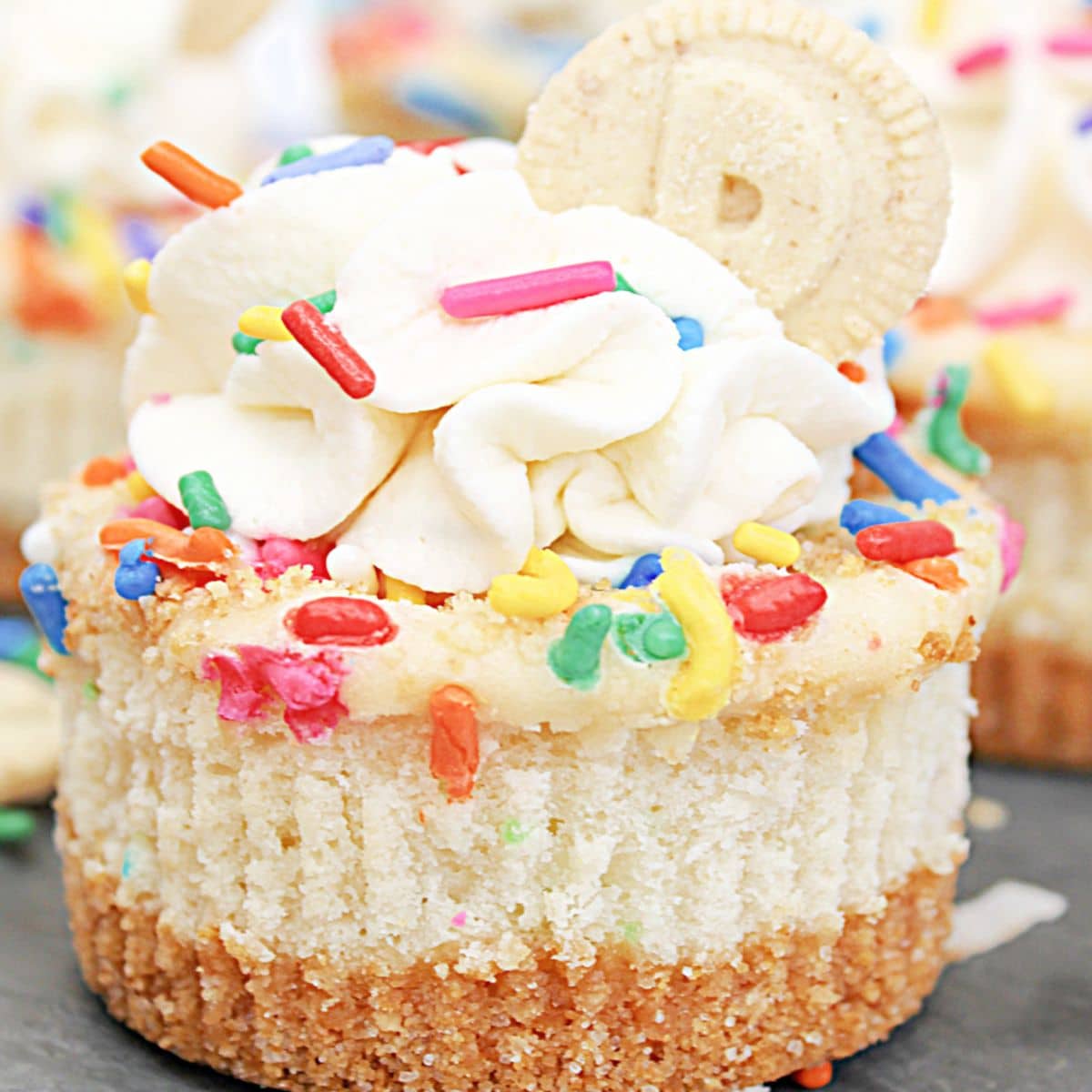 mini dunkaroo cheesecakes on a piece of marble.