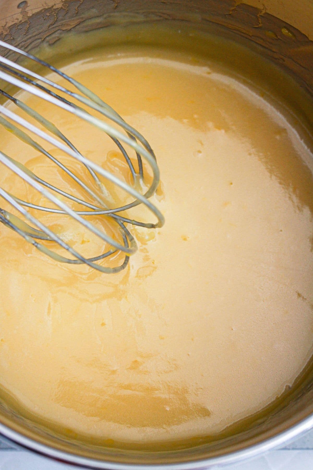 topping being cooked in a saucepan.