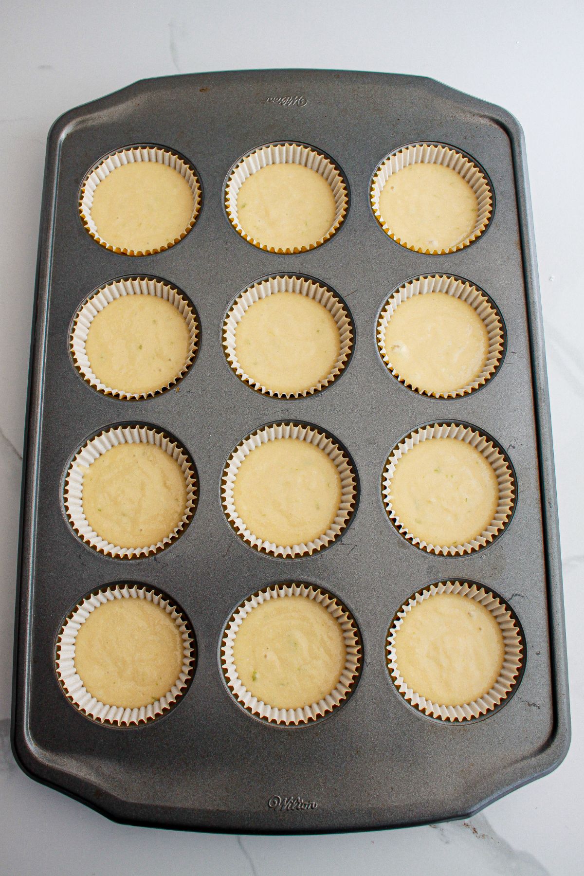 cupcake batter in a cupcake pan ready for the oven.