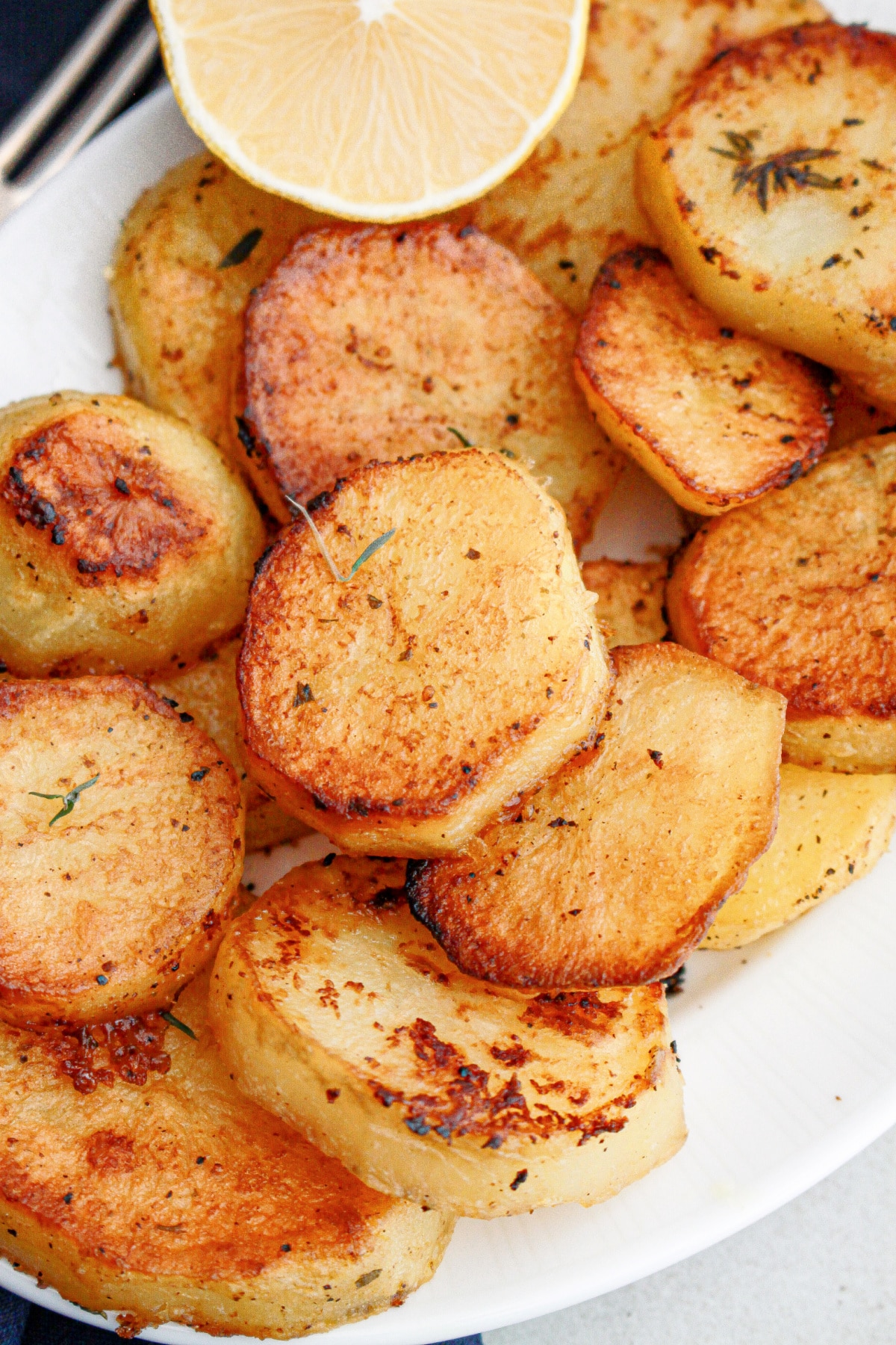 melting potatoes stacked on a plate.