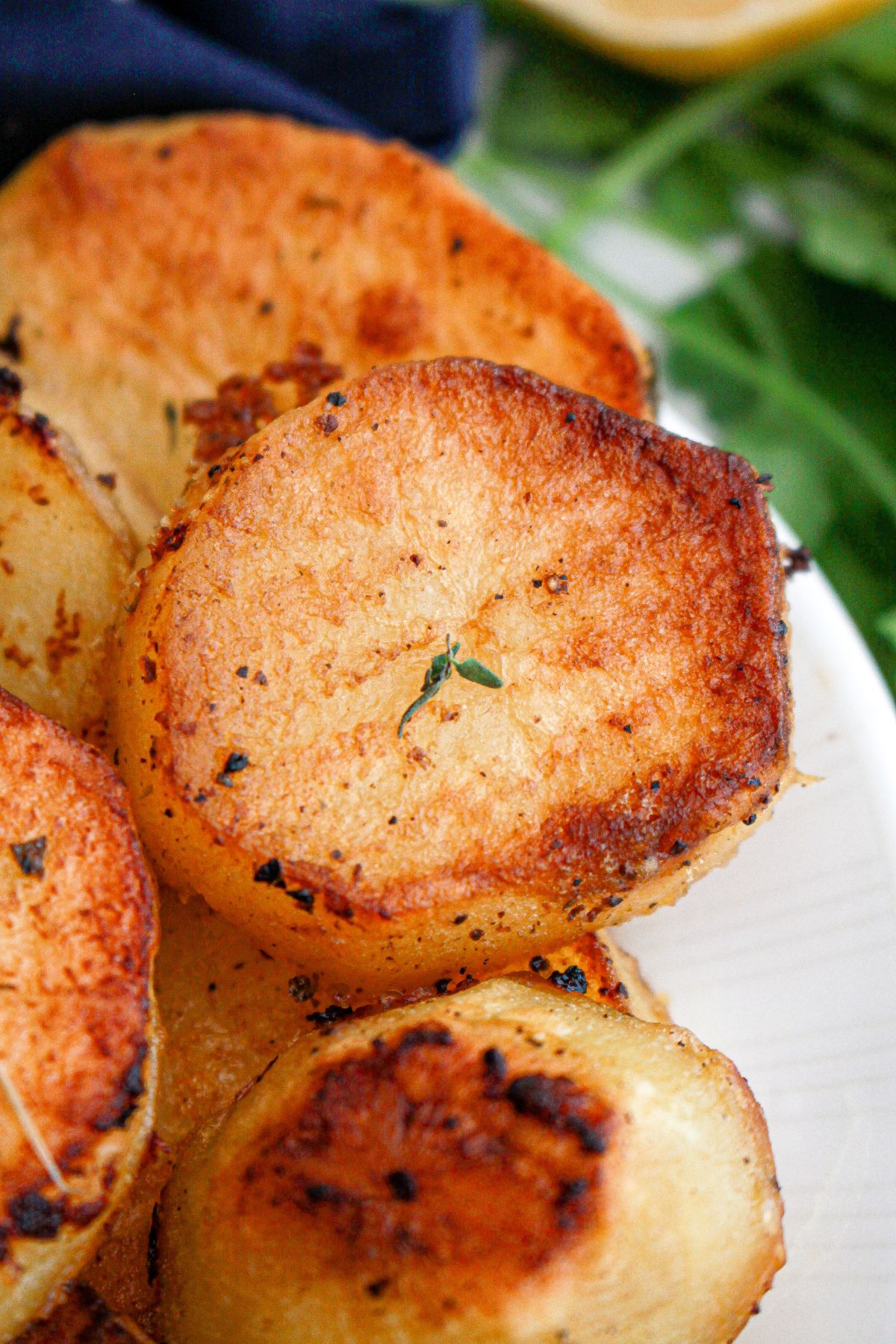 melting potatoes stacked on a plate.