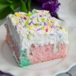 slice of pastel easter cake on a small plate.