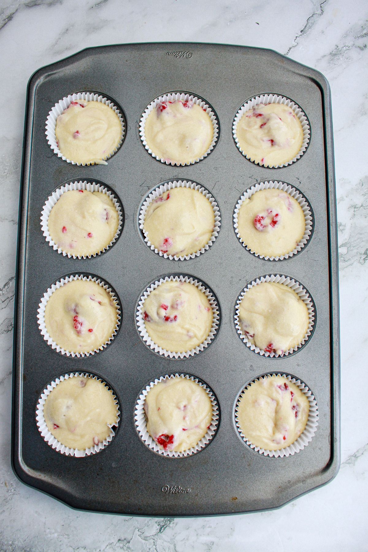 cupcake batter in a cupcake pan ready for the oven.