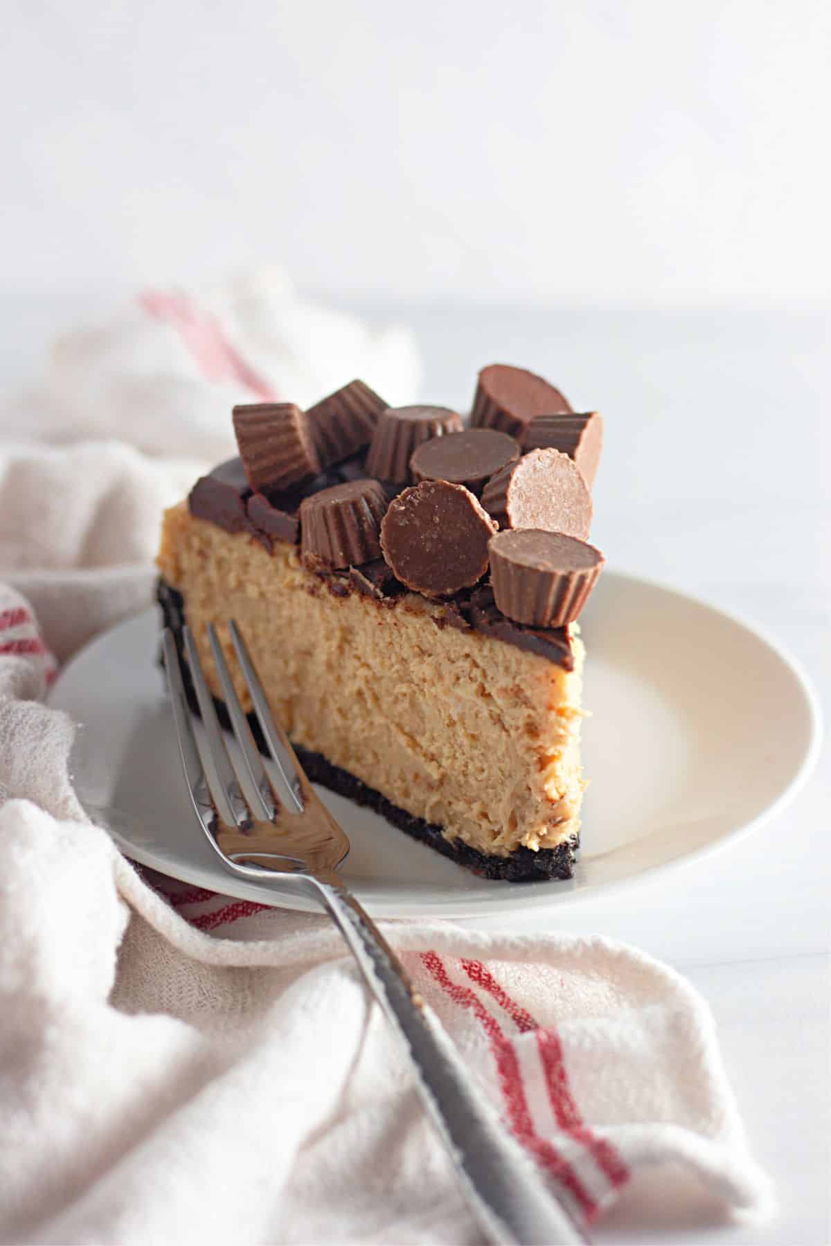 slice of reese's cheesecake on a small plate.