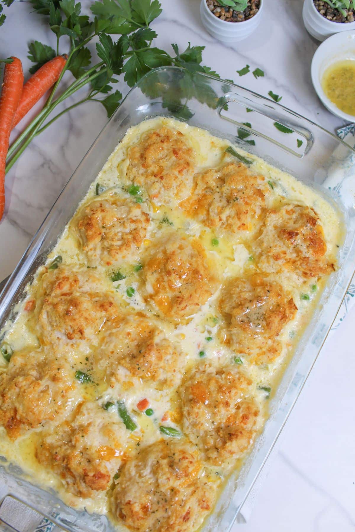 uncut seafood casserole in a glass baking dish.