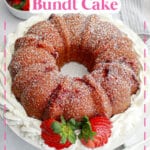 uncut strawberry bundt cake surrounded by whipped cream.