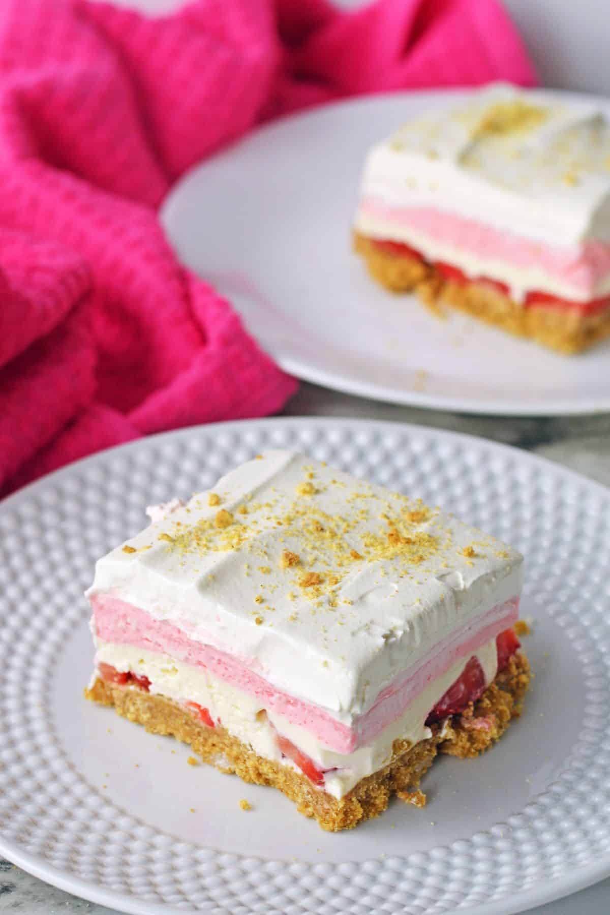 slice of no bake strawberry delight on a plate.