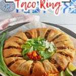 uncut taco crescent ring on a parchment lined baking sheet.