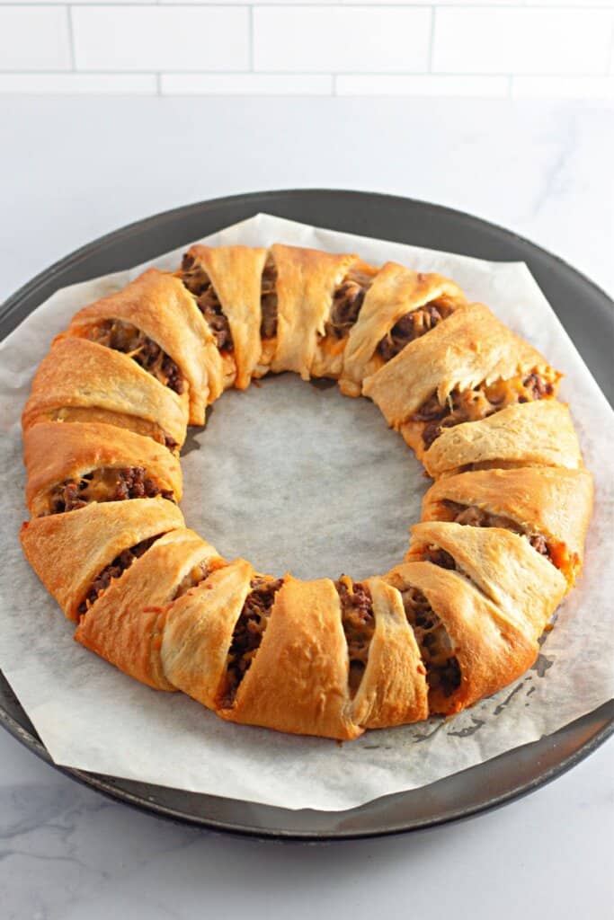 baked taco crescent ring on a pizza pan.