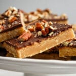 pieces of toffee squares on a cake plate.
