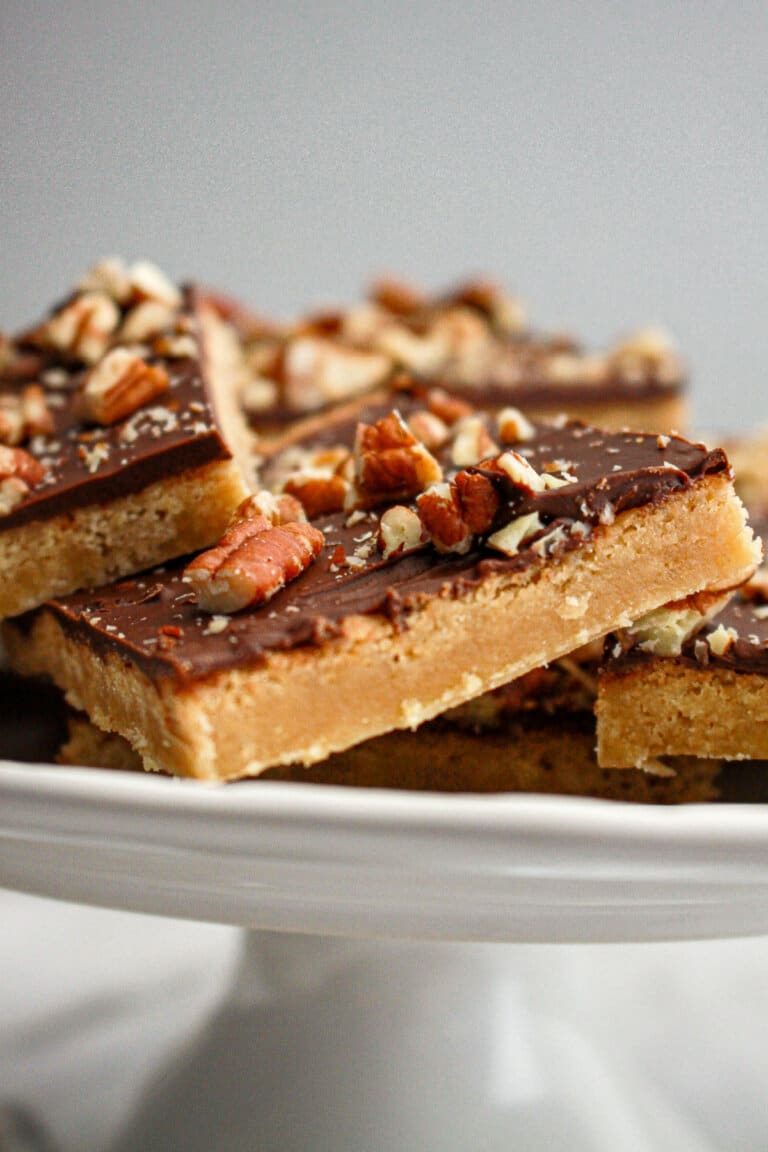 pieces of toffee squares on a cake plate.