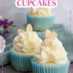 two almond cupcakes on a marble backdrop.