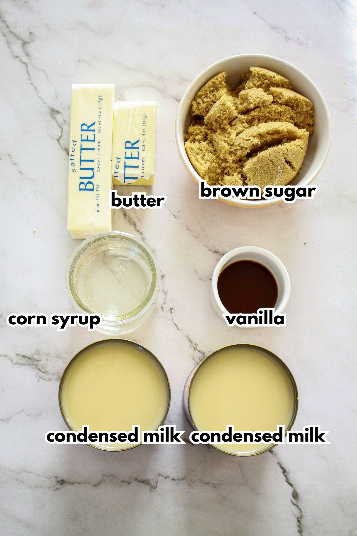 bowls of butter, brown sugar, corn syrup, vanilla, and condensed milk on counter.