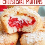 cherry cheesecake muffins stacked on a plate the top one has a bite missing.