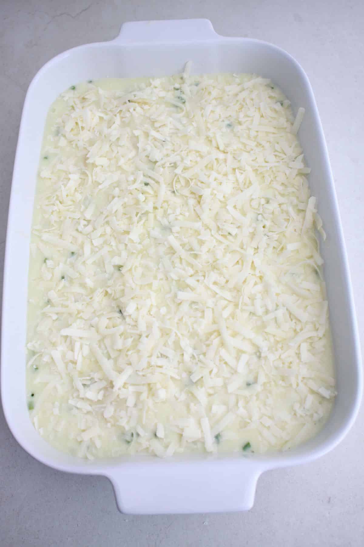 cream sauce and potatoes in a baking dish.