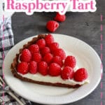 slice of chocolate raspberry tart on a plate.