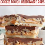 three salted cookie dough billionaire bars stacked on top of each other on a counter.
