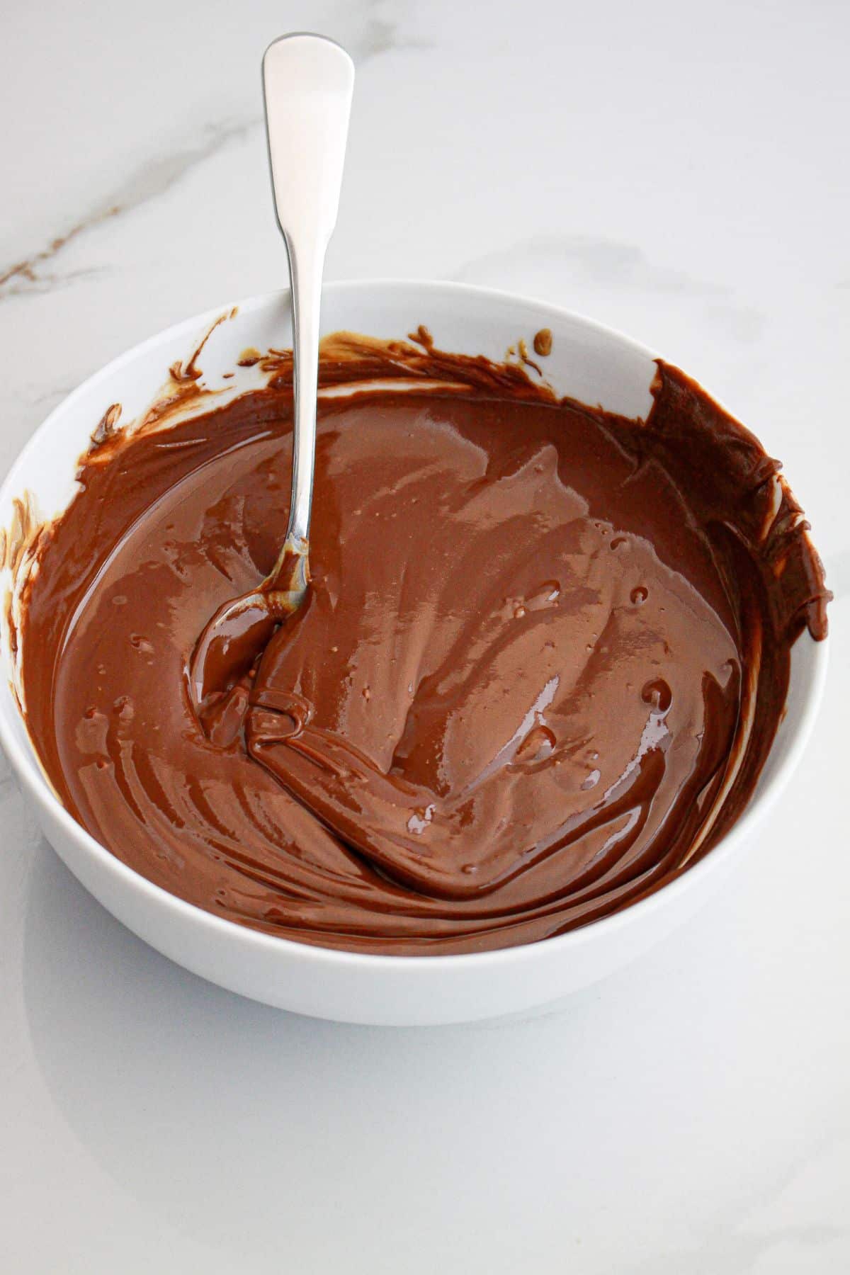 chocolate and peanut butter being melted in a bowl.