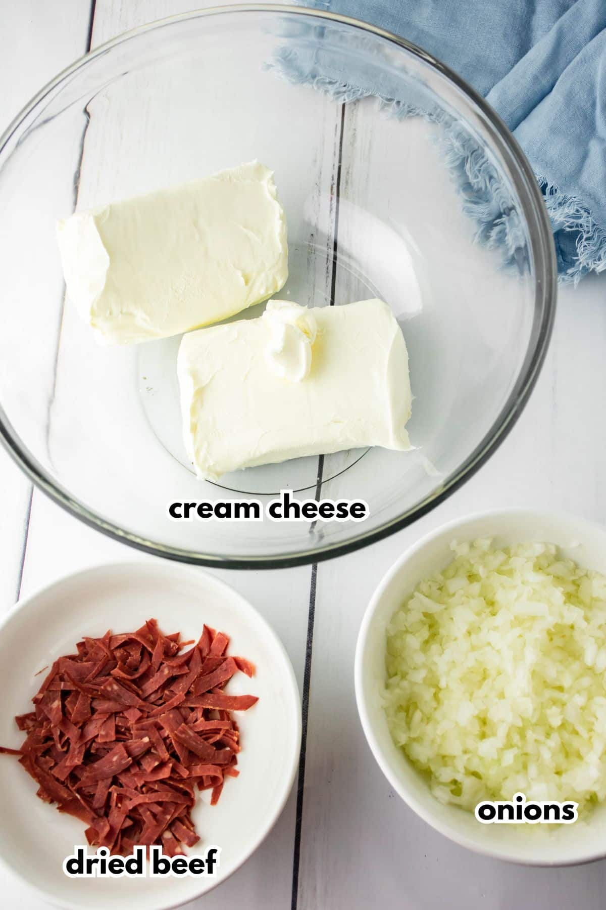 bowls of cream cheese, dried beef, and onions.