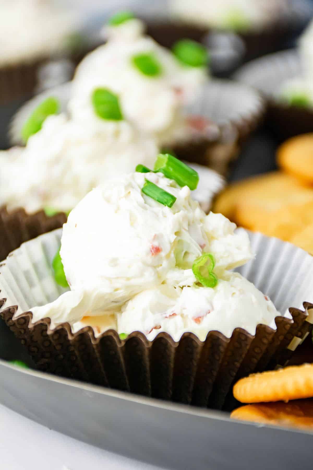 dried beef cheese ball in a paper cupcake liner