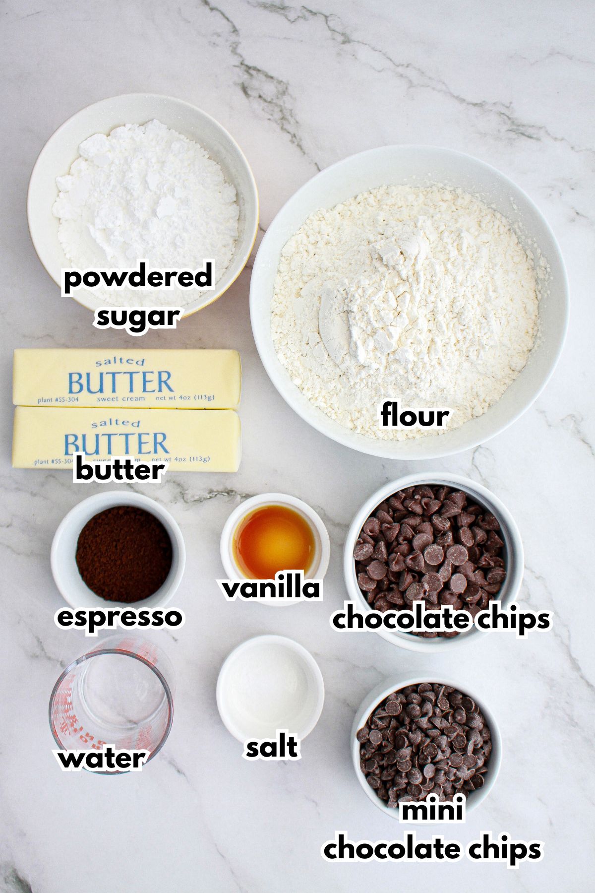 bowls of powdered sugar, butter, flour, espresso, water, vanilla, salt, and chocolate chips.