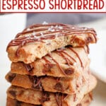 five pieces of espresso shortbread stacked on top of each other with a bite missing from the top one.