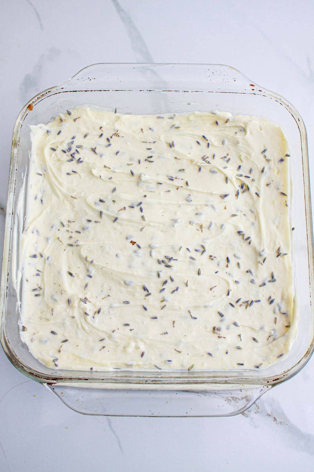 cheesecake filling in a baking dish ready for the oven.