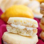 two lemon meltaway cookies stacked on top of each other.