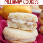 two lemon meltaway cookies stacked on top of each other.