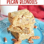 three maple pecan blondies stacked on table on a plate.